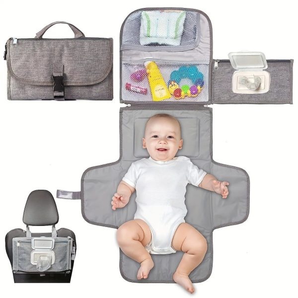 Tapis à langer portable avec poche à lingettes ouvert